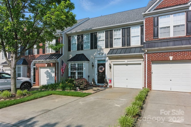 158 Snead Rd, Fort Mill, SC 29715 - townhome / multi-family property featuring brick siding, a standing seam roof, driveway, a shingled roof, and a metal roof