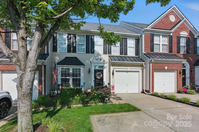 158 Snead Rd, Fort Mill, SC 29715 - view of property featuring brick siding, a garage, concrete driveway, roof with shingles, and a standing seam roof