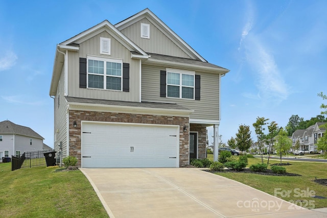 223 Haddonsfield Dr, Mooresville, NC 28115 - view of front of home featuring board and batten siding, stone siding, concrete driveway, and an attached garage