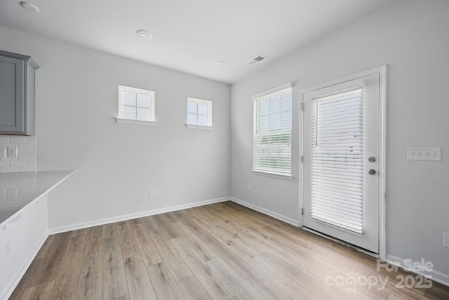 223 Haddonsfield Dr, Mooresville, NC 28115 - unfurnished dining area featuring light wood-type flooring and baseboards