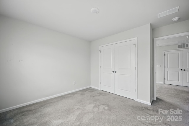 223 Haddonsfield Dr, Mooresville, NC 28115 - unfurnished bedroom featuring carpet, baseboards, and a closet