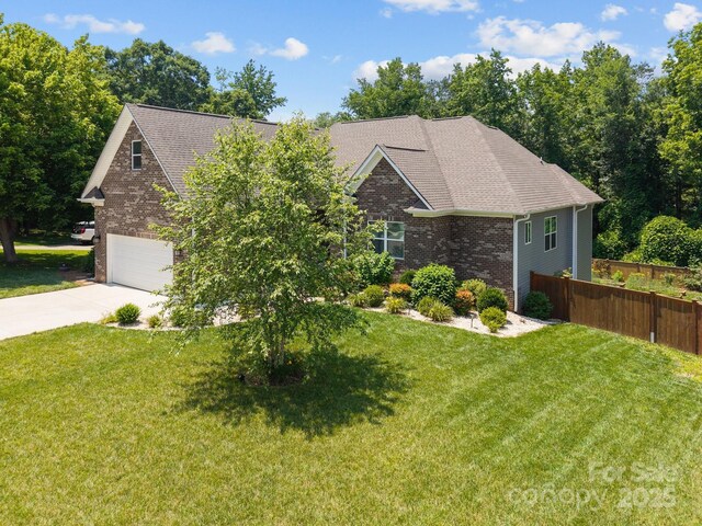 3633 Longpond Ln, Monroe, NC 28110 - view of front of home with brick siding, concrete driveway, a shingled roof, and an attached garage