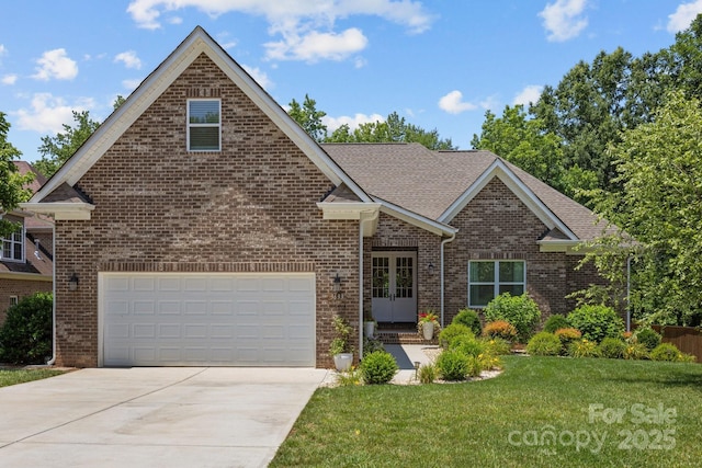 3633 Longpond Ln, Monroe, NC 28110 - traditional home featuring french doors, concrete driveway, brick siding, a front yard, and a garage