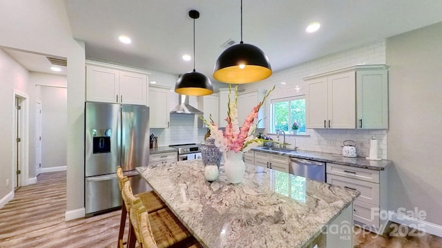 3633 Longpond Ln, Monroe, NC 28110 - kitchen with stainless steel appliances, a sink, baseboards, light stone countertops, and recessed lighting