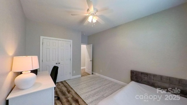 3633 Longpond Ln, Monroe, NC 28110 - bedroom with a closet, baseboards, ceiling fan, and wood finished floors