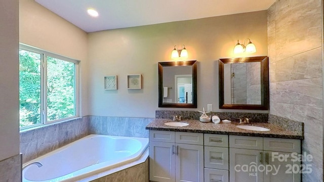 3633 Longpond Ln, Monroe, NC 28110 - full bathroom featuring plenty of natural light, double vanity, and a bath