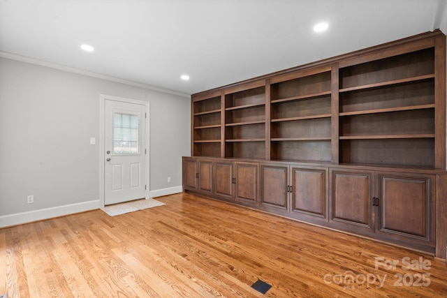 315 Red Barn Trl, Matthews, NC 28104 - spare room with crown molding, light wood-style floors, and recessed lighting