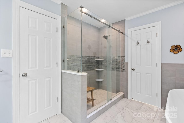 315 Red Barn Trl, Matthews, NC 28104 - bathroom featuring marble look tiles, a stall shower, a freestanding bath, ornamental molding, and tile walls