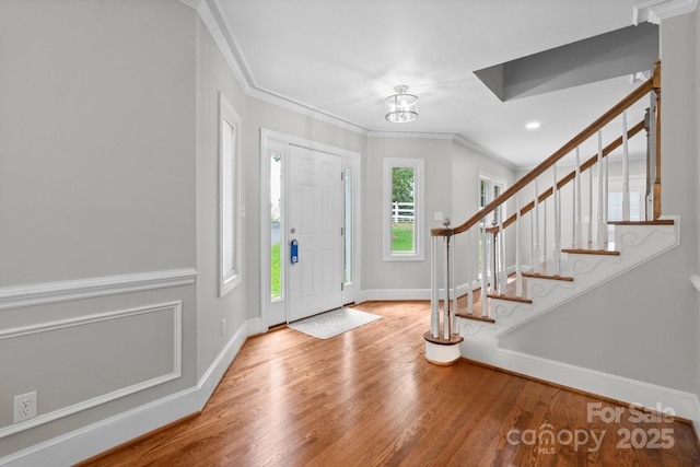315 Red Barn Trl, Matthews, NC 28104 - foyer featuring wood finished floors, ornamental molding, and stairway