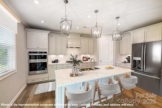 9864 Quercus Ln, Huntersville, NC 28078 - kitchen with appliances with stainless steel finishes, a sink, a chandelier, a kitchen breakfast bar, and an island with sink