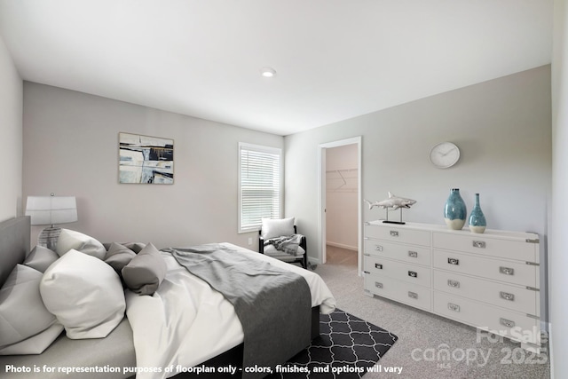 9864 Quercus Ln, Huntersville, NC 28078 - bedroom with light colored carpet, a walk in closet, and a closet