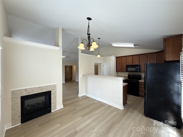 1423 Napa St NW, Concord, NC 28027 - kitchen featuring black appliances, vaulted ceiling, light wood-style flooring, pendant lighting, and baseboards