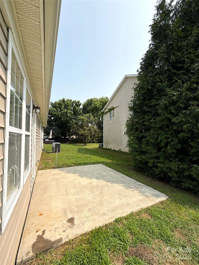 1423 Napa St NW, Concord, NC 28027 - view of grassy yard with a patio area and central AC