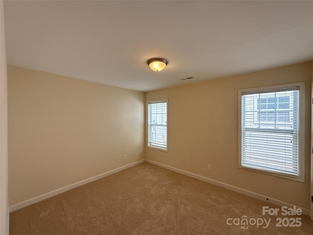 1423 Napa St NW, Concord, NC 28027 - empty room with baseboards and light carpet