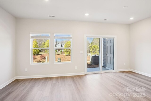 1413 Old Rivers Rd, Concord, NC 28027 - spare room featuring light wood-style flooring, recessed lighting, and baseboards