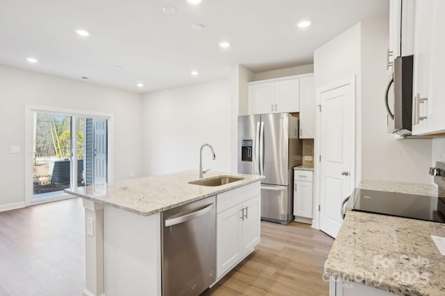 1413 Old Rivers Rd, Concord, NC 28027 - kitchen with appliances with stainless steel finishes, a sink, an island with sink, white cabinetry, and light stone counters