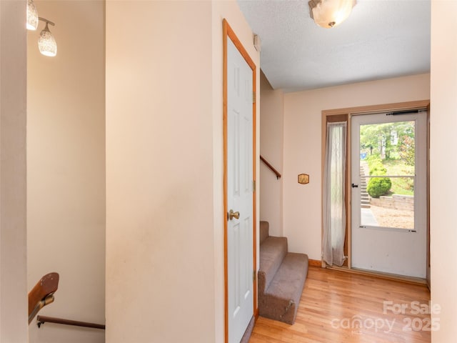 51 Wake Robin Way, Asheville, NC 28805 - entryway with light wood-style flooring, stairs, and baseboards