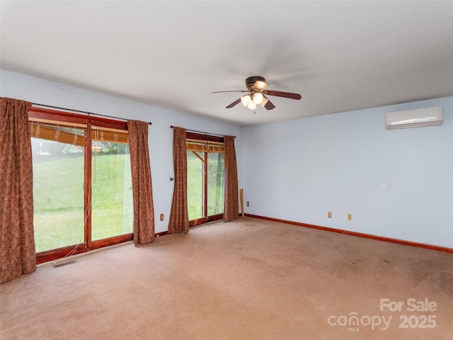 51 Wake Robin Way, Asheville, NC 28805 - carpeted empty room featuring an AC wall unit, ceiling fan, and baseboards