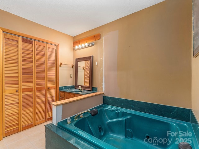 51 Wake Robin Way, Asheville, NC 28805 - bathroom with a closet, a whirlpool tub, tile patterned floors, and vanity