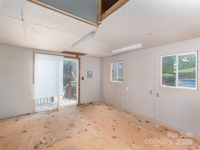 51 Wake Robin Way, Asheville, NC 28805 - empty room with healthy amount of natural light and electric panel