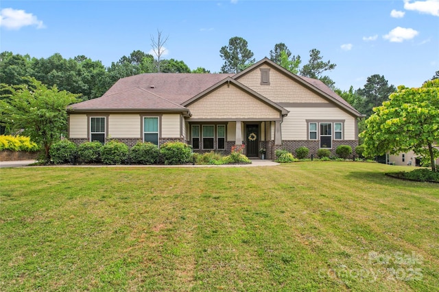 137 Leaning Tower Dr, Mooresville, NC 28117 - craftsman-style house featuring brick siding, a porch, and a front lawn