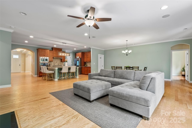 137 Leaning Tower Dr, Mooresville, NC 28117 - living room featuring arched walkways, recessed lighting, ceiling fan, crown molding, and baseboards