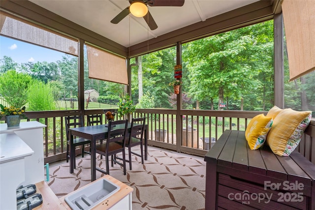 137 Leaning Tower Dr, Mooresville, NC 28117 - sunroom / solarium featuring a ceiling fan, outdoor dining space, and view of wooded area
