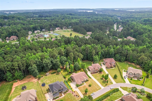 137 Leaning Tower Dr, Mooresville, NC 28117 - aerial perspective of suburban area with a heavily wooded area