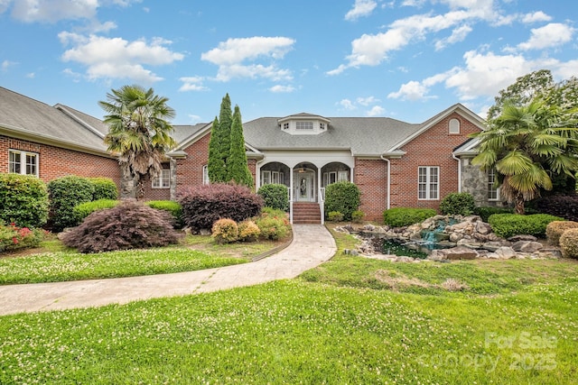 6823 Manatee Dr, Concord, NC 28025 - traditional home with brick siding and a front yard