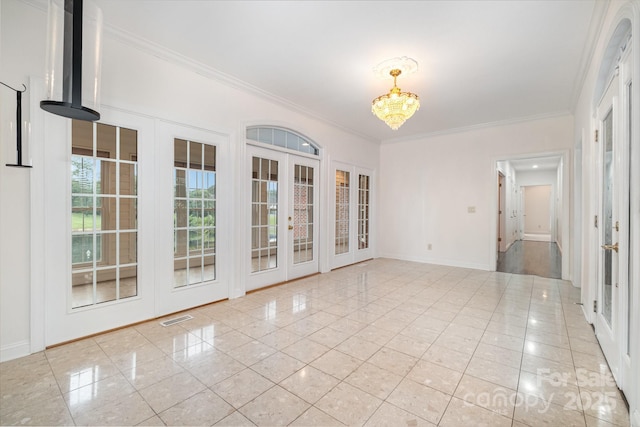 6823 Manatee Dr, Concord, NC 28025 - empty room with french doors, a chandelier, crown molding, baseboards, and light tile patterned flooring