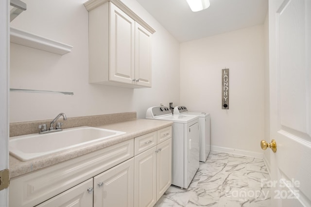 6823 Manatee Dr, Concord, NC 28025 - laundry room featuring cabinet space, light marble finish flooring, washing machine and clothes dryer, and baseboards