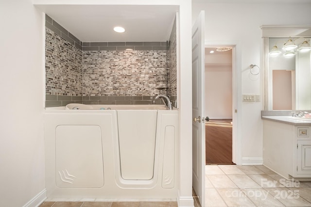 6823 Manatee Dr, Concord, NC 28025 - full bathroom featuring tile patterned floors, a bath, vanity, and recessed lighting