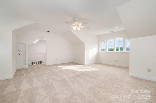 6823 Manatee Dr, Concord, NC 28025 - additional living space with a ceiling fan, light colored carpet, vaulted ceiling, recessed lighting, and baseboards
