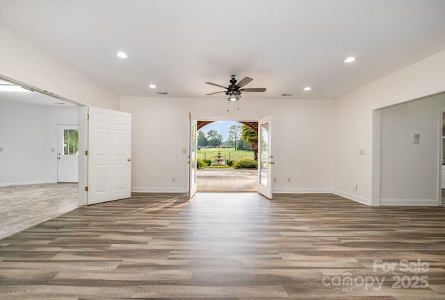 6823 Manatee Dr, Concord, NC 28025 - unfurnished room featuring ceiling fan, recessed lighting, wood finished floors, and baseboards