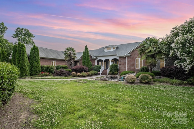 6823 Manatee Dr, Concord, NC 28025 - view of front of house with brick siding and a front yard