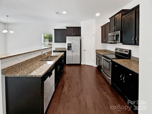 108 Greenway View Ct, Mount Holly, NC 28120 - kitchen with stainless steel appliances, a sink, dark wood-style flooring, a kitchen island with sink, and recessed lighting