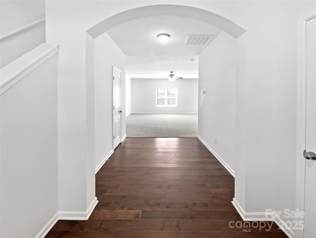 108 Greenway View Ct, Mount Holly, NC 28120 - hallway featuring arched walkways, dark wood-style flooring, and baseboards