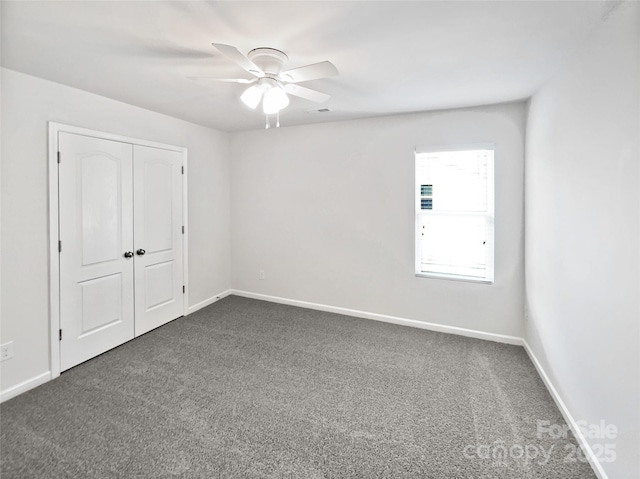108 Greenway View Ct, Mount Holly, NC 28120 - unfurnished bedroom featuring dark carpet, baseboards, and a closet