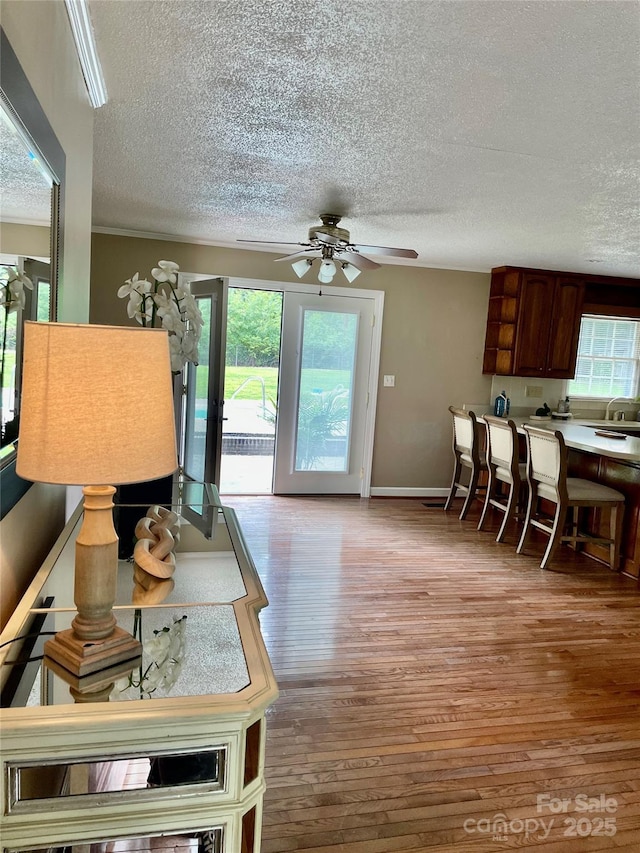 218 Hardin Cir, Grover, NC 28073 - living area featuring a textured ceiling, ceiling fan, wood finished floors, and baseboards