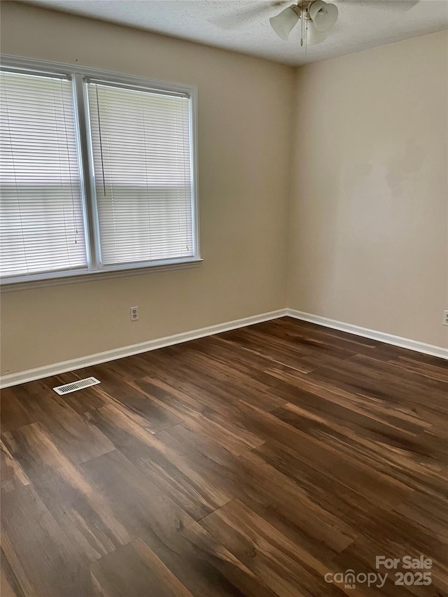 218 Hardin Cir, Grover, NC 28073 - empty room with dark wood-type flooring, ceiling fan, and baseboards