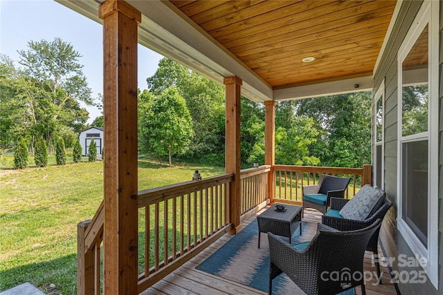 17 Baxter Woods Ln, Candler, NC 28715 - deck with a yard, a storage unit, view of wooded area, and an outdoor living space