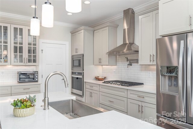 17 Baxter Woods Ln, Candler, NC 28715 - kitchen with stainless steel appliances, wall chimney range hood, backsplash, light countertops, and glass insert cabinets