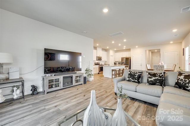 322 Olympia Way, York, SC 29745 - living room with light wood-style floors and recessed lighting
