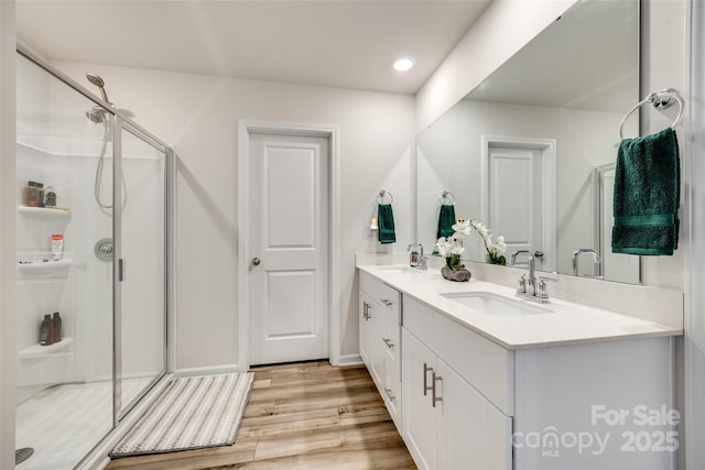 322 Olympia Way, York, SC 29745 - bathroom featuring double vanity, a shower stall, wood finished floors, and recessed lighting