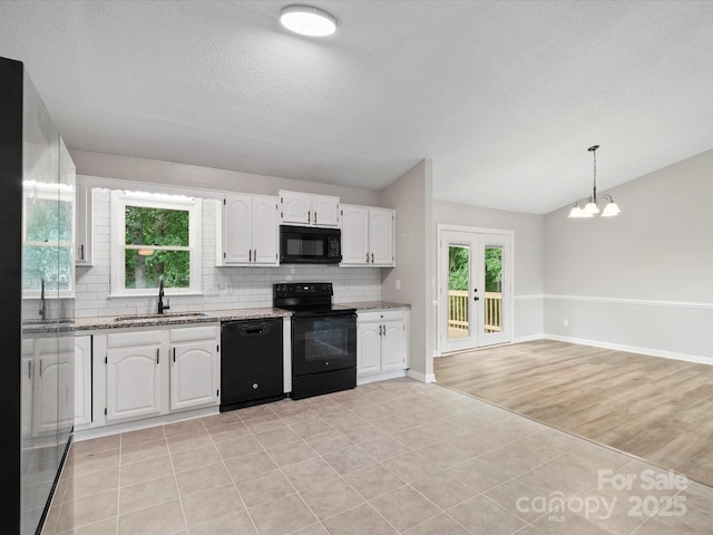 3124 5th Street Pl NE, Hickory, NC 28601 - kitchen featuring black appliances, a sink, tasteful backsplash, white cabinets, and light stone countertops