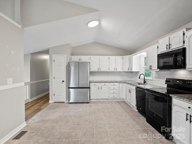 3124 5th Street Pl NE, Hickory, NC 28601 - kitchen with black appliances, a sink, lofted ceiling, stone countertops, and backsplash