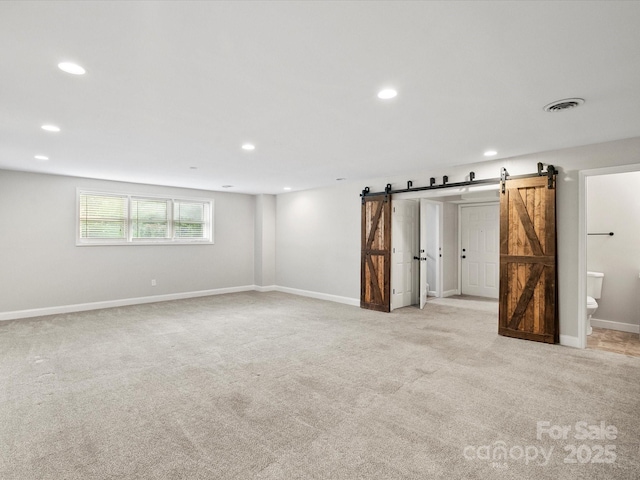 3124 5th Street Pl NE, Hickory, NC 28601 - basement featuring a barn door, carpet, recessed lighting, and baseboards