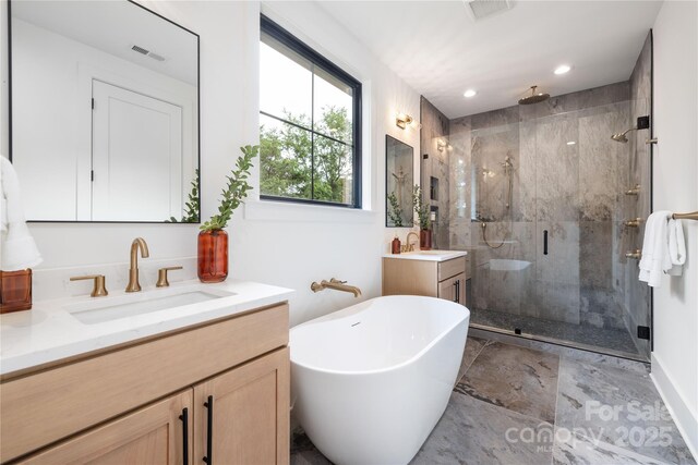 3903 Plainview Rd, Charlotte, NC 28208 - full bath featuring a stall shower, vanity, a freestanding bath, and recessed lighting