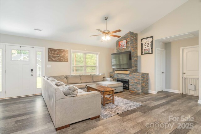 198 Anita Ln, Lexington, NC 27295 - living room with wood finished floors, a stone fireplace, a ceiling fan, lofted ceiling, and baseboards