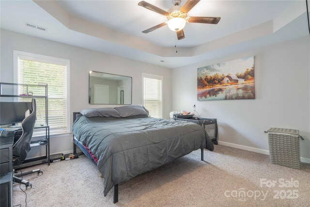 198 Anita Ln, Lexington, NC 27295 - carpeted bedroom with baseboards, a tray ceiling, ceiling fan, and a desk
